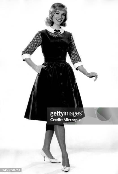 Reveille fashion 1962: Jo Waring modelling a velvet pinafore dress. 8th February 1962.
