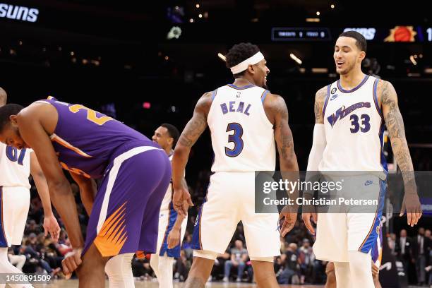 Bradley Beal and Kyle Kuzma of the Washington Wizards celebrate during the final moments of the second half of the NBA game against the Phoenix Suns...