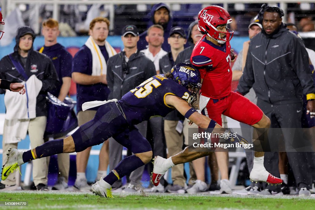 Maxen Hook of the Toledo Rockets tackles Kaidon Salter of the Liberty
