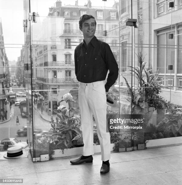 Man modelling the latest 1963 designs outside a Paris boutique. 25th April 1963.