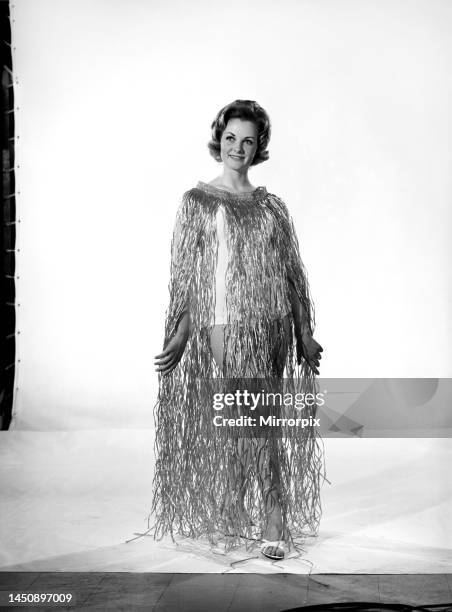 Roma Reeves wears a grass dress. Circa 1963.