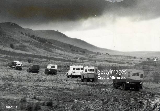 Churning through layers of mud, a line of Land Rovers move cross country towards the Black Mountains in Wales, 14th March 1960.