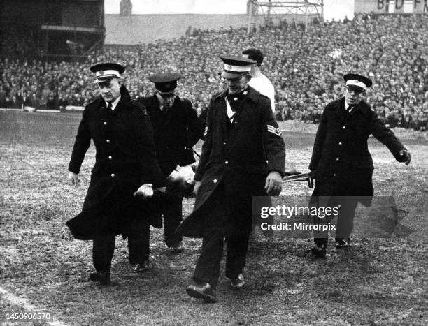 Brian Clough is carried from the field by the St John Ambulance Brigade after injuring his knee in the Sunderland versus Bury game. 26th December...