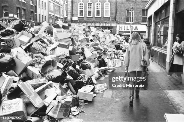 Rubbish piled up on streets of London, due to industrial action by refuse collectors, Soho, London, Winter of Discontent, Tuesday 30th january 1979.