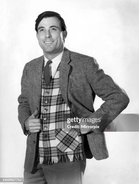 Peter Anthony wearing suit jacket over a tartan waistcoat, shirt and tie stands with hand on hips. 10th February 1961.