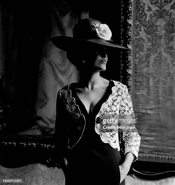 Pictures taken at a charity fashion show held at Welbeck Abbey near Worksop, Nottingham. A Model wearing Christian Dior wide brimmed hat with flower...