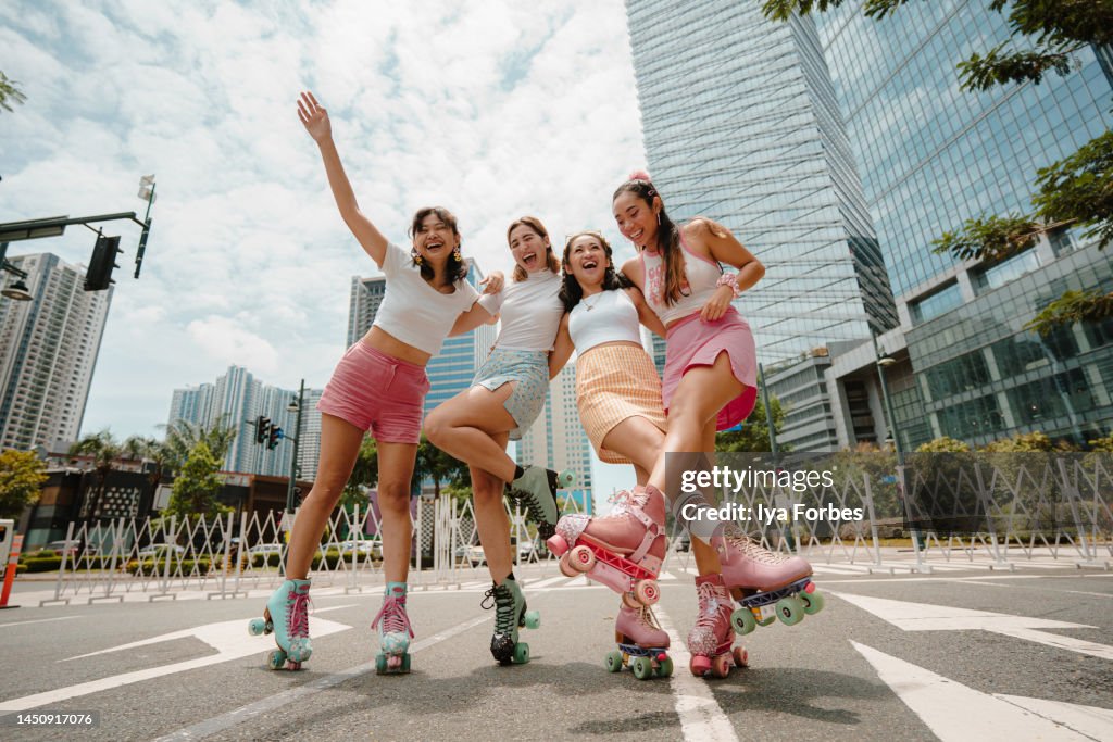 Portrait of Young Filipino Women Roller Skaters in the City