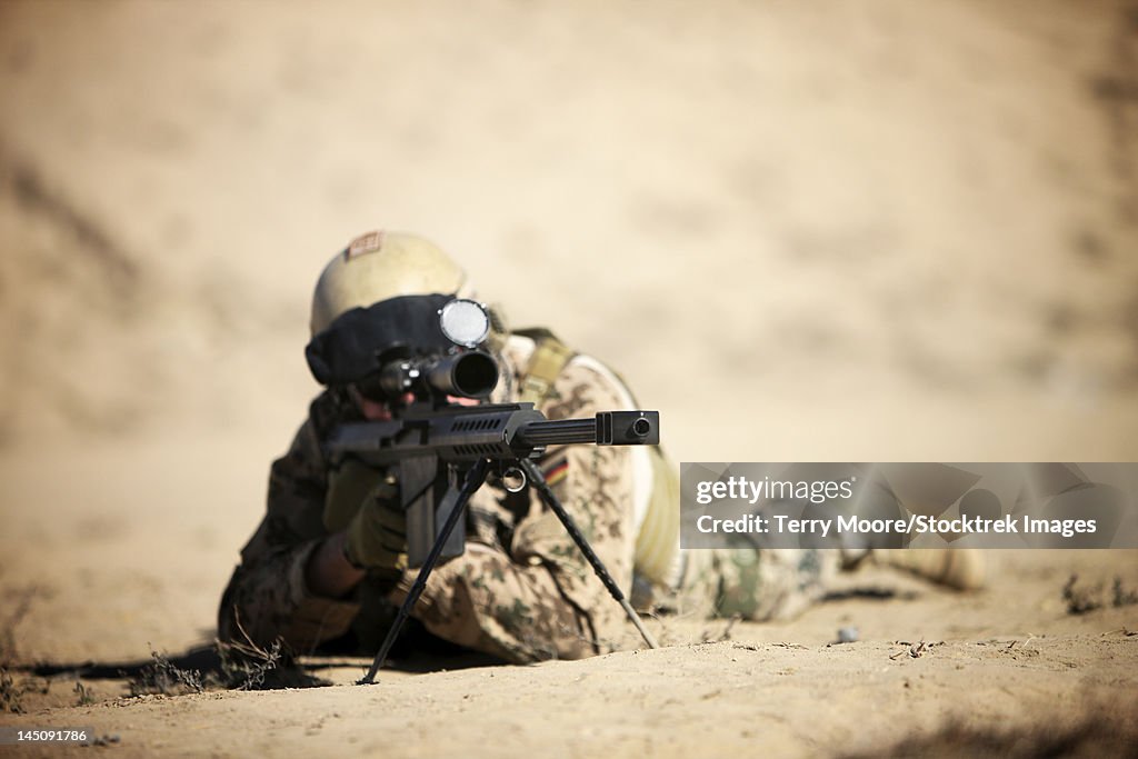 A German soldier sights in a Barrett M82A1 rifle on a range in Kunduz, Afghanistan.