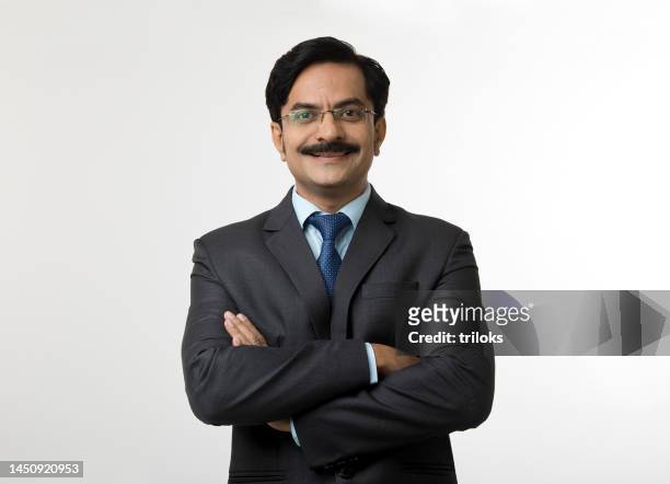 portrait of businessman with arms crossed - mustache stock pictures, royalty-free photos & images