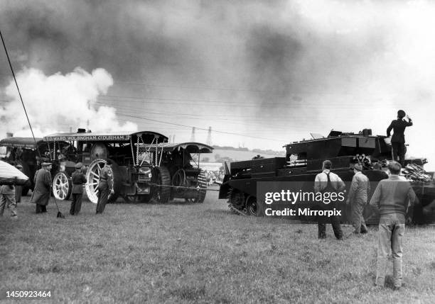 Traction engines and a tank having a tug of war at a Steam Rally. 10th June 1961.