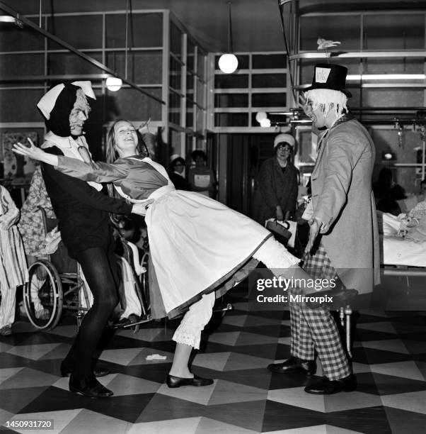 Children of Booth Hall Hospital meet character from Alice in Wonderland: March Hare Alice Mad Hatter during the production of Alice in Wonderland in...