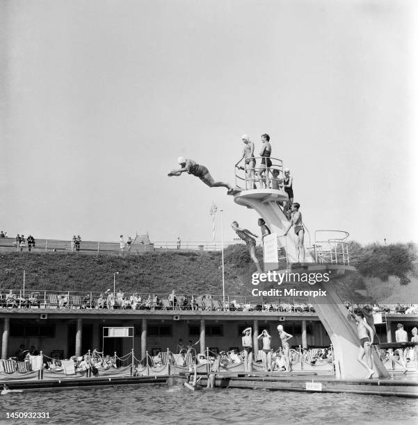 Taking The Plunge. . . 75 year old Molly Pendleton diving from a 16ft. 6in diving board. Brighton, East Sussex. 26th August 1960.