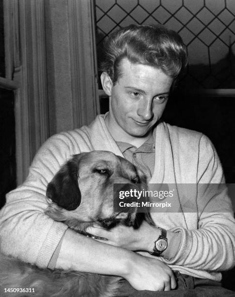 Denis Law, Manchester City, relaxes at his digs in Goulden Road, Withington, after his six goal in the mud feat at Luton. Dennis looks glum as he...