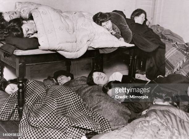 Suffragettes pictured sleeping at home of a friend who refuses to fill up her schedule for the National Census - Afterwards they have arranged to...