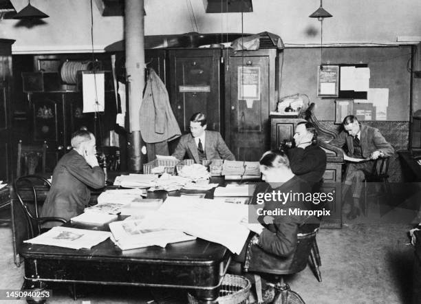 Daily Mirror News Room in Bouverie Street circa 1920. Left to Right William Rider Rider H. F. Pothecary W. E. Owen in foreground , John Haydon and...