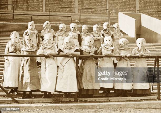 World War One - The stands of a Tottenham Hotspur football ground have been turned into a workshop, making gas masks helmets and other protective...