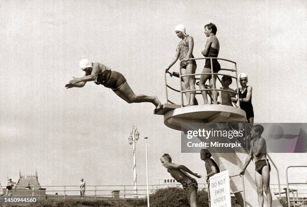 Taking The Plunge. . . 75 year old Molly Pendleton diving from a 16ft. 6in diving board. Brighton, East Sussex. 26th August 1960.