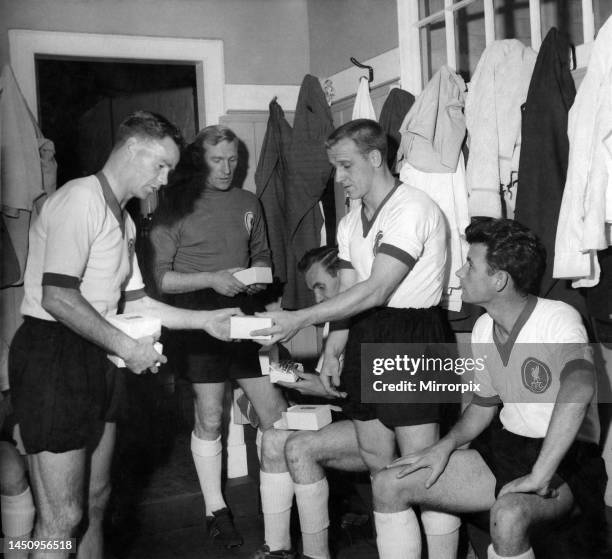 Billy Liddell meets opposition team players in the changing room at Anfield before his testimonial match, L-R Billy Liddell, Bert Trautmann, Rowley,...