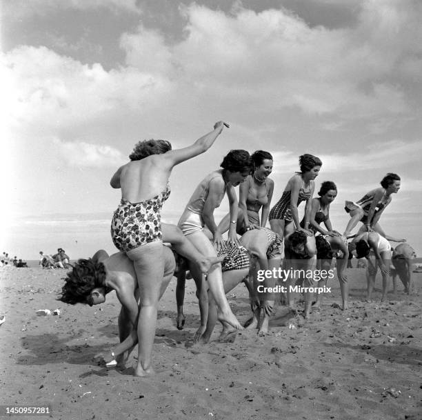 Beauty contest girls playing on the beach at Ramsgate. 31st August 1960.