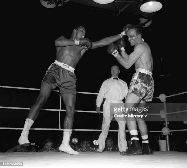 Action during the non-title heavyweight fight between American Cassius Clay and British fighter Henry Cooper at Wembley Stadium, London. Thirty five...
