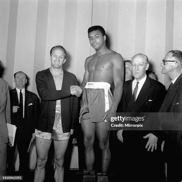 Big fight weigh in at the London Palladium for tonight's Wembley non-title fight between Henry Cooper and Cassius Clay . 18th June 1963.