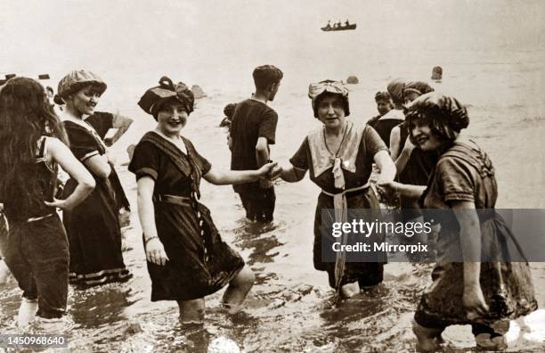 Edwardian Ladies in their bathing costumes paddling in the seacirca 1906.