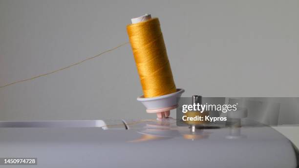 sewing thread spooling thread onto bobbin - rolled up stock pictures, royalty-free photos & images