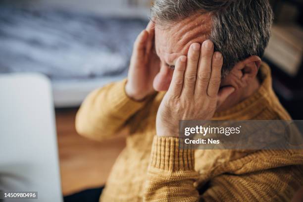 headache, the man massages his head - head injury stock pictures, royalty-free photos & images