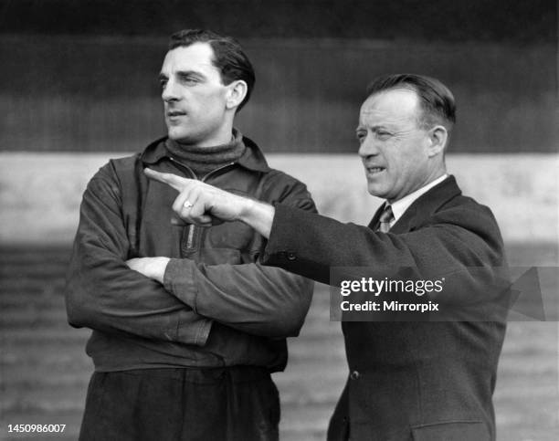 Trainer R. Liddell gives a word of advice to J. McCue, the Stoke City left-full-back. February 1951.