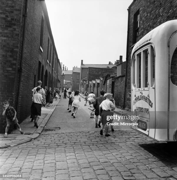 Children playing in the streets of Oldham. July 1952.