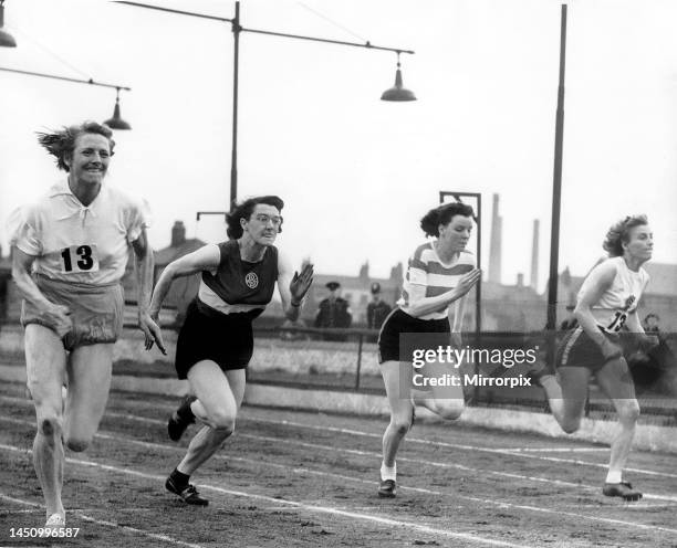 Fanny Blankers-Koen of Holland running ahead to win the Women's 100 yards final from E. M Greenwood of Bolton U Harriers, J A Newbolt of Sheffield...