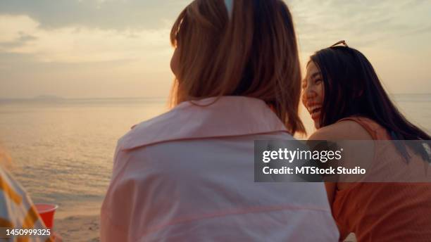 close up group of young asian women celebrating and drinking alcohol on tropical beach. - asian female friends drinking soda outdoor stock pictures, royalty-free photos & images