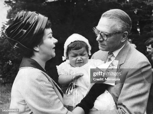 Laurence Olivier and Joan Plowright at daughter Tamsin's christening. 1st July 1963.