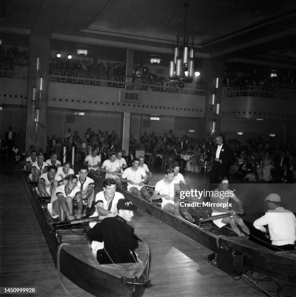 The Oxford and Cambridge boat race crews re enact the race at the Lords Tavener Ball, Grosvenor House. July 1952.