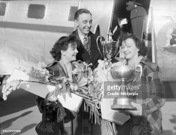 Rosalind and Diane Rowe, 17 year old twins who won the women's doubles at the world table tennis championship. Pictured here at London Airport with...