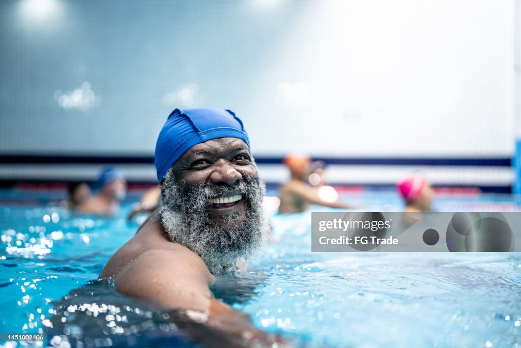Portrait of a senior man at swimming pool