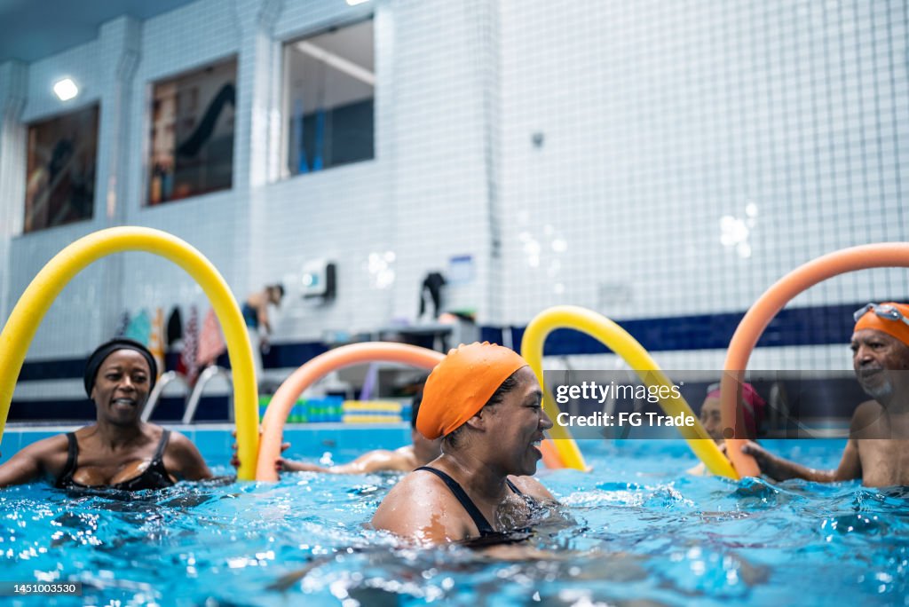 Educate Pool Users Teacher Explaining Exercises At Swimming Pool High-Res Stock Photo ...