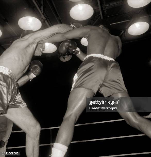 Action during the non-title heavyweight fight between American Cassius Clay and British fighter Henry Cooper at Wembley Stadium, London. Thirty five...