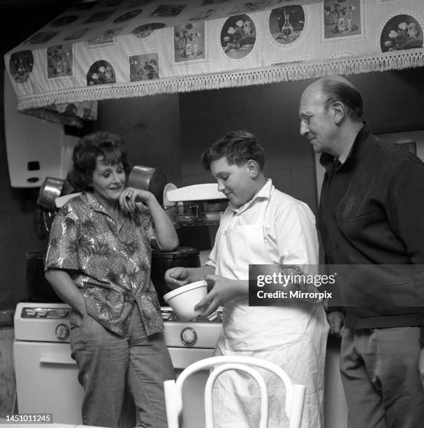 Johnny Cradock with pupil cook John Harper and TV cook Fanny Cradock, John is beating an omelette mixture. 28th October 1962.