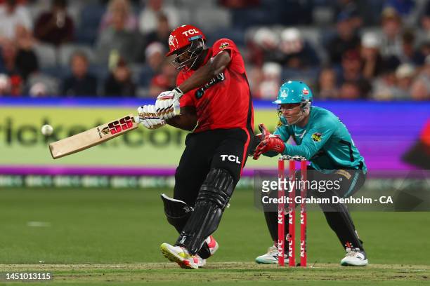 Andre Russell of the Renegades hits a six during the Men's Big Bash League match between the Melbourne Renegades and the Brisbane Heat at GMHBA...