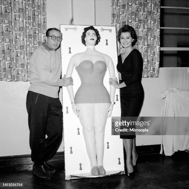Actress Sophia Loren standing before the presentation of a life size cake of herself. 20th September 1962.
