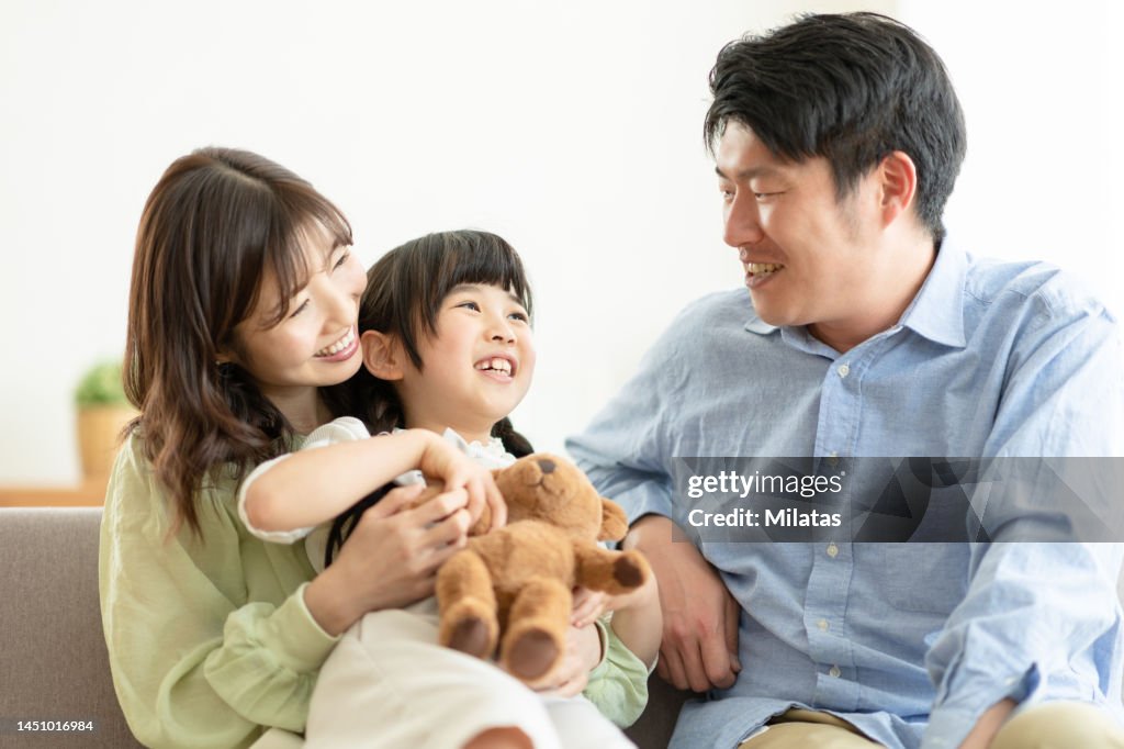 Portrait of a family sitting on the couch