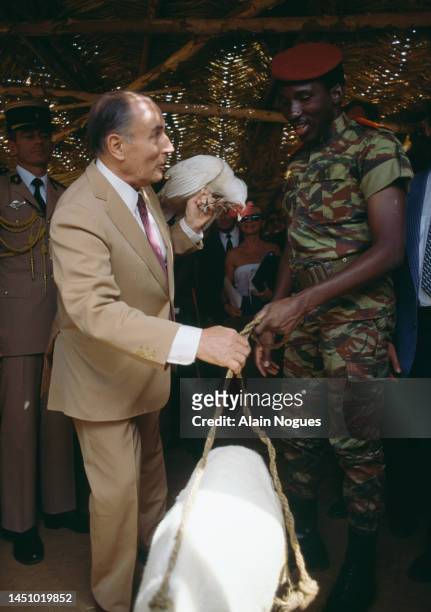 During his official visit to Burkina Faso, French President, Francois Mitterrand, visits a local market with Burkina Faso President, Thomas Sankara,...
