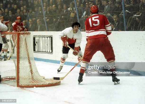 Parise of Canada skates with the puck behind the net as Alexander Yakushev of the Soviet Union defends during the 1972 Summit Series in September,...