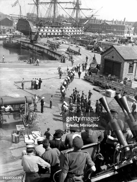 The 16th Independent Parachute Brigade Group travelled from Aldershot to Portsmouth in special trains today and marched to the Royal Naval Dockyard,...