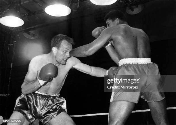 Action during the non-title heavyweight fight between American Cassius Clay and British fighter Henry Cooper at Wembley Stadium, London. Thirty five...