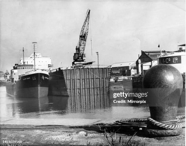 The 23,000 ton tanker Rondefjell has a new middle section fitted to convert it into a 26,000 ton bulk carrier at a shipyard on the River Wear, 1951.