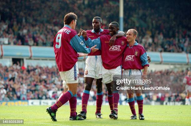 September 1996 - FA Premier League - Aston Villa v Arsenal - Savo Milosevic of Villa celebrates scoring a goal with Ugo Ehigu, Dwight Yorke and Alan...