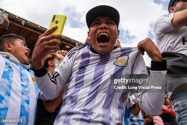 Argentinian fans react during the live transmission of the FIFA World Cup Qatar final between Argentina and France in Bogota, Colombia, December 18,...