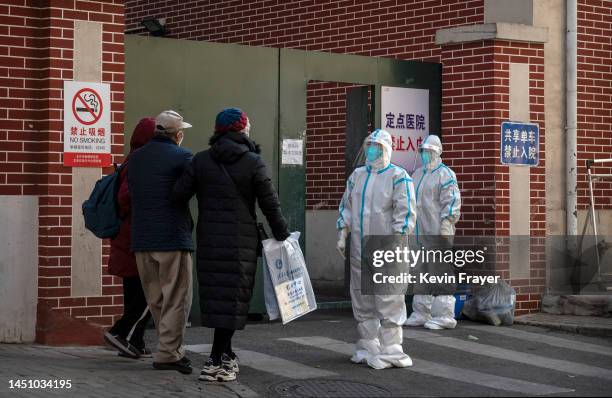 Medical staff wear PPE as they wait to assist a patient at a fever clinic treating COVID-19 patients on December 21, 2022 in Beijing, China. Chinas...